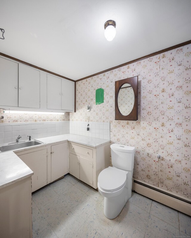 205 Luther Dr, Southbury, CT 06488 - bathroom featuring wallpapered walls, a baseboard radiator, and ornamental molding