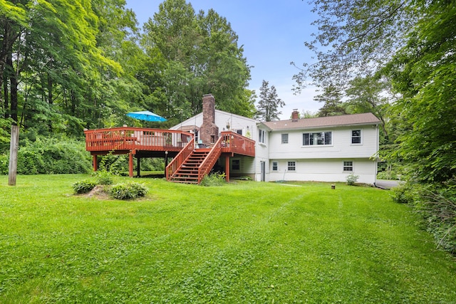 205 Luther Dr, Southbury, CT 06488 - rear view of house with a deck, stairs, a yard, and a chimney