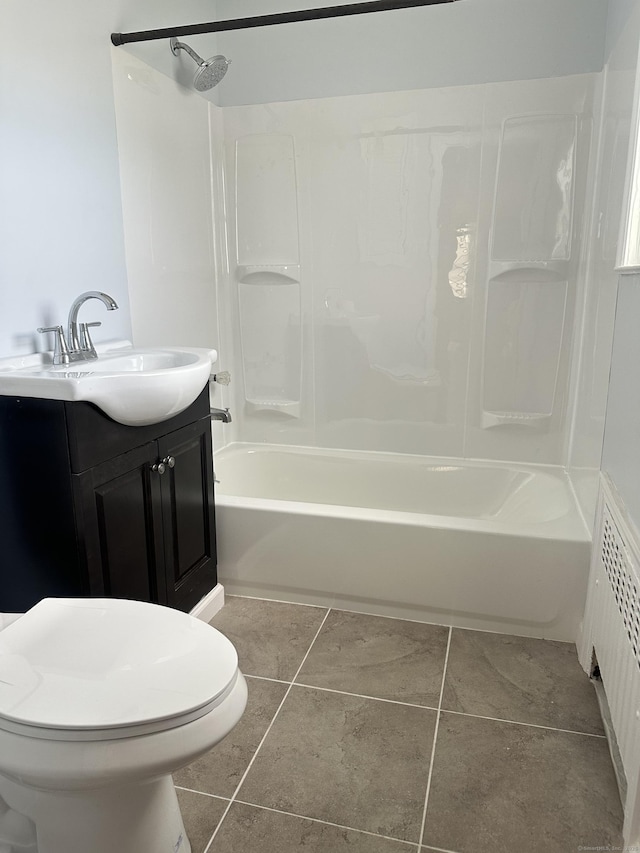 27 Woodbridge Ave, East Hartford, CT 06108 - bathroom featuring  shower combination, vanity, radiator, and tile patterned floors