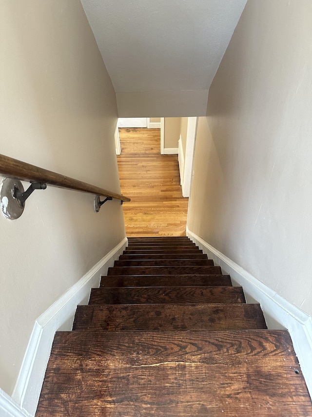 27 Woodbridge Ave, East Hartford, CT 06108 - stairs with baseboards and wood finished floors