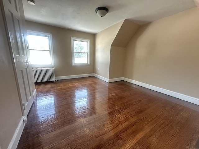 27 Woodbridge Ave, East Hartford, CT 06108 - bonus room with radiator and dark wood-style floors