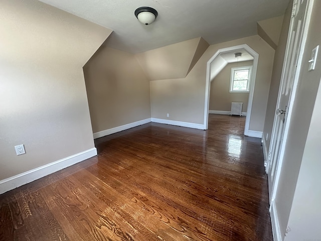 27 Woodbridge Ave, East Hartford, CT 06108 - bonus room with vaulted ceiling, wood finished floors, and radiator