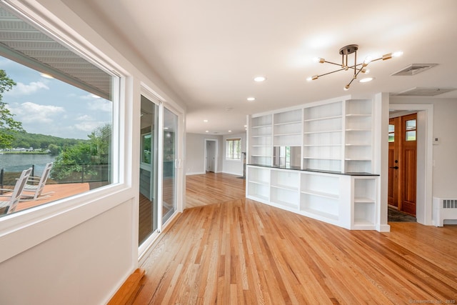 100 N Lake Shore Dr, Brookfield, CT 06804 - unfurnished living room featuring a chandelier, light wood-style floors, and recessed lighting