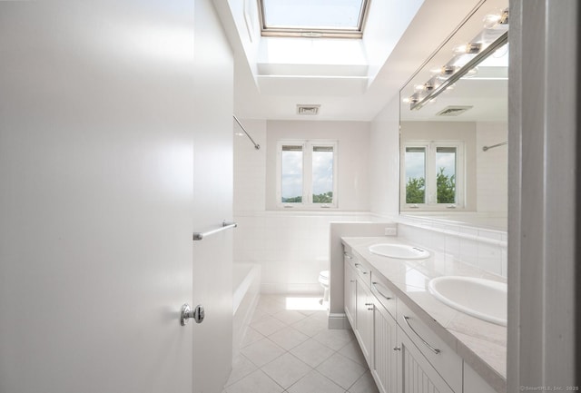 100 N Lake Shore Dr, Brookfield, CT 06804 - bathroom with a skylight, tile patterned flooring, double vanity, shower / bathtub combination, and tile walls