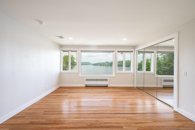 100 N Lake Shore Dr, Brookfield, CT 06804 - spare room featuring radiator, light wood-type flooring, recessed lighting, and a smoke detector