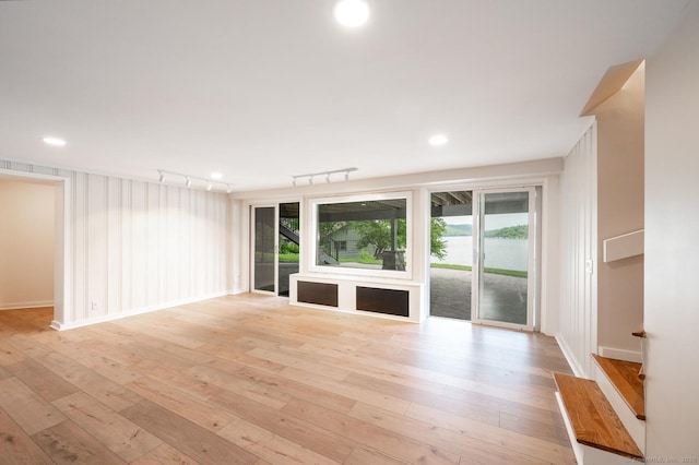 100 N Lake Shore Dr, Brookfield, CT 06804 - unfurnished living room with light wood-style flooring and rail lighting