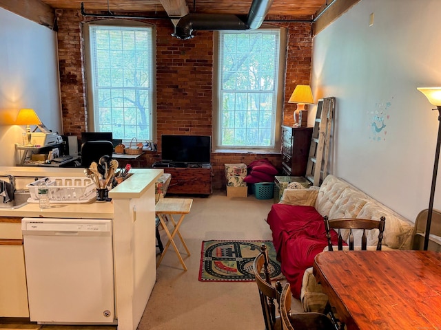 92 Main St Apt 102, Deep River, CT 06417 - carpeted living room with healthy amount of natural light and brick wall