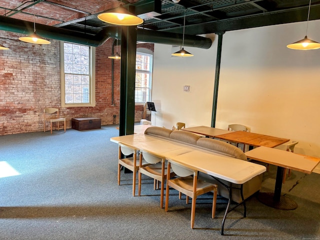 92 Main St Apt 102, Deep River, CT 06417 - carpeted dining space with brick wall