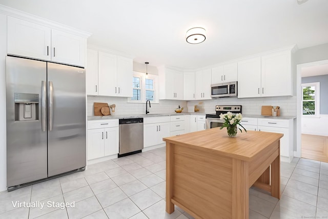 19 Robert St, Hamden, CT 06514 - kitchen featuring stainless steel appliances, light countertops, and backsplash
