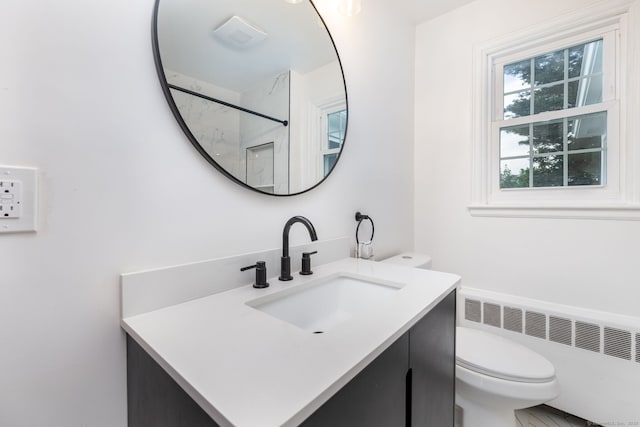 19 Robert St, Hamden, CT 06514 - bathroom with radiator heating unit, vanity, and a shower