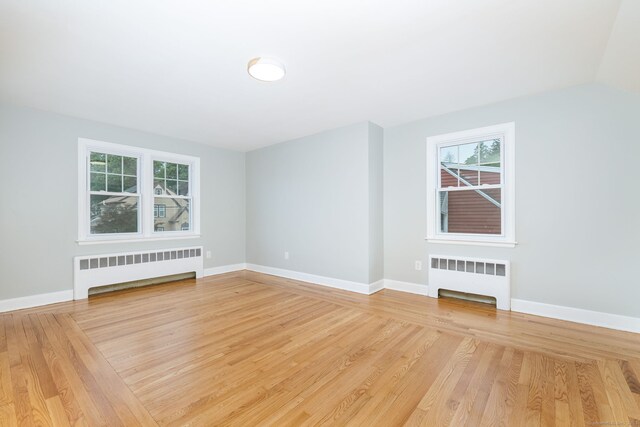 19 Robert St, Hamden, CT 06514 - unfurnished room with radiator and light wood-style flooring