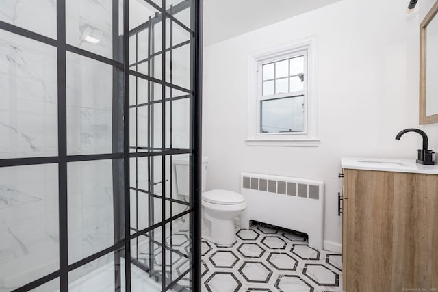 19 Robert St, Hamden, CT 06514 - full bathroom with radiator, vanity, and a marble finish shower