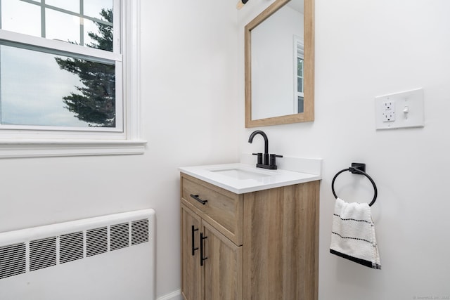 19 Robert St, Hamden, CT 06514 - bathroom with radiator heating unit and vanity