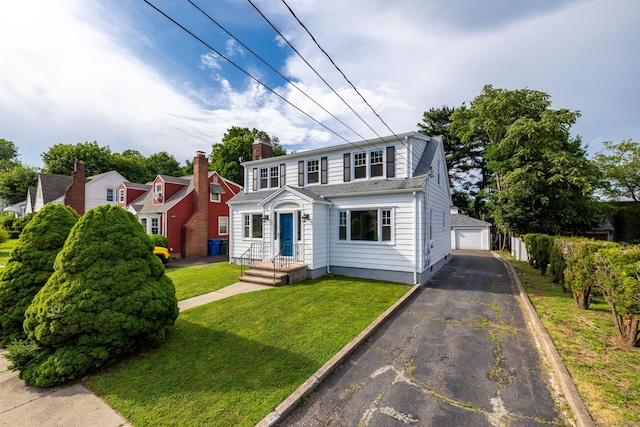 19 Robert St, Hamden, CT 06514 - view of front of house with a garage, a front lawn, and an outdoor structure