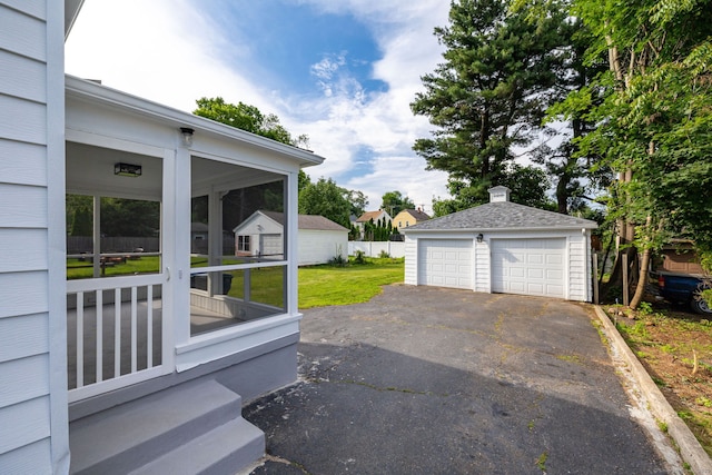 19 Robert St, Hamden, CT 06514 - view of grassy yard featuring a sunroom, an outbuilding, and a detached garage