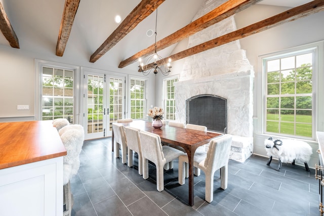 509 Main St N, Woodbury, CT 06798 - dining room featuring a chandelier, dark tile patterned flooring, a fireplace, and french doors