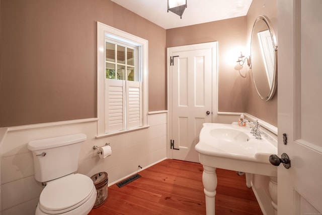 509 Main St N, Woodbury, CT 06798 - half bath featuring wood finished floors and toilet
