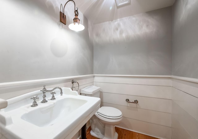 509 Main St N, Woodbury, CT 06798 - half bathroom with toilet and wood finished floors
