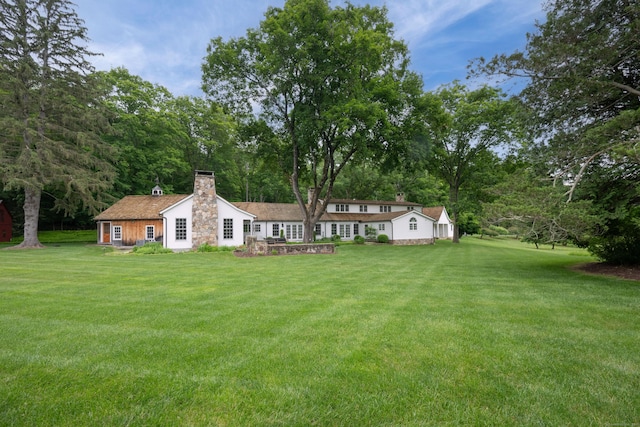 509 Main St N, Woodbury, CT 06798 - back of property with a chimney and a lawn