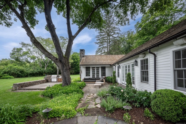 509 Main St N, Woodbury, CT 06798 - view of green lawn featuring a patio and french doors