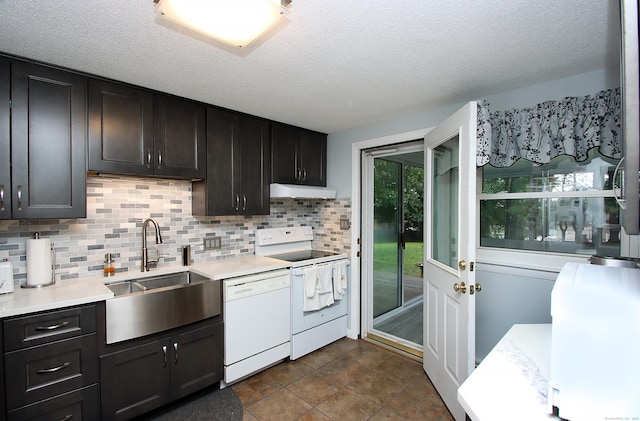 134 Valley Crest Dr, Wethersfield, CT 06109 - kitchen with white appliances, light countertops, under cabinet range hood, backsplash, and a textured ceiling