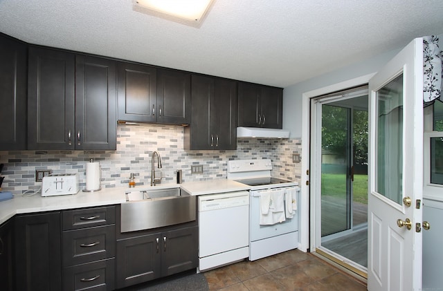 134 Valley Crest Dr, Wethersfield, CT 06109 - kitchen featuring white appliances, under cabinet range hood, light countertops, backsplash, and a textured ceiling