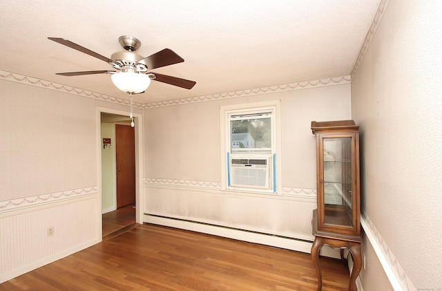 134 Valley Crest Dr, Wethersfield, CT 06109 - empty room featuring baseboard heating, wood finished floors, a ceiling fan, and cooling unit