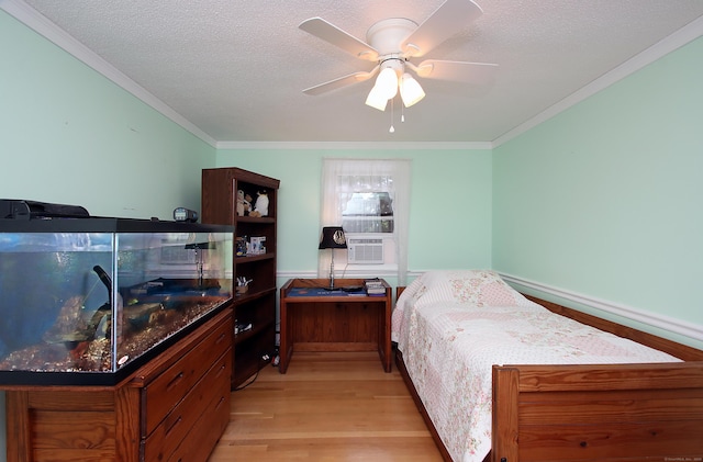 134 Valley Crest Dr, Wethersfield, CT 06109 - bedroom with crown molding, light wood-style flooring, and a textured ceiling