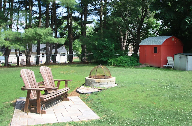 134 Valley Crest Dr, Wethersfield, CT 06109 - view of yard with a fire pit and a storage unit