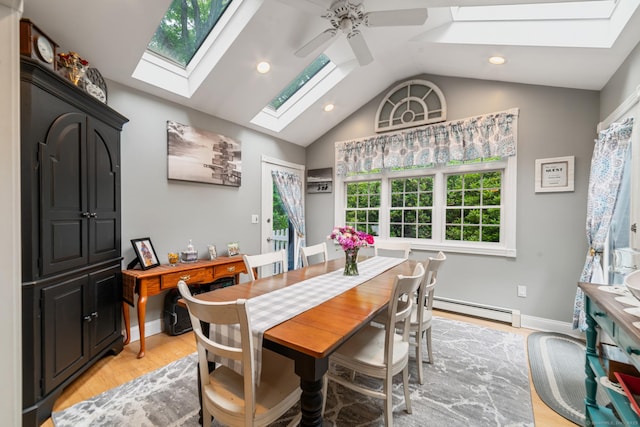 2 Bronson Rd, Prospect, CT 06712 - dining area with a skylight, a baseboard heating unit, a ceiling fan, vaulted ceiling, and light wood-style floors