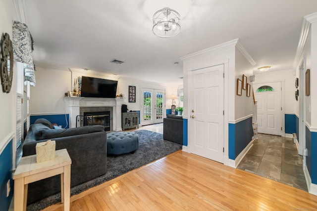 2 Bronson Rd, Prospect, CT 06712 - living area with a fireplace, wood finished floors, ornamental molding, and french doors