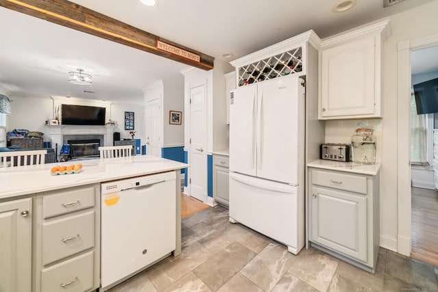 2 Bronson Rd, Prospect, CT 06712 - kitchen featuring white appliances, a glass covered fireplace, light countertops, open floor plan, and recessed lighting