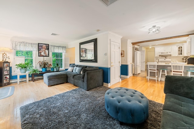 2 Bronson Rd, Prospect, CT 06712 - living room featuring light wood finished floors and ornamental molding