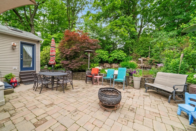 2 Bronson Rd, Prospect, CT 06712 - view of patio / terrace with a fire pit, outdoor dining area, and view of wooded area