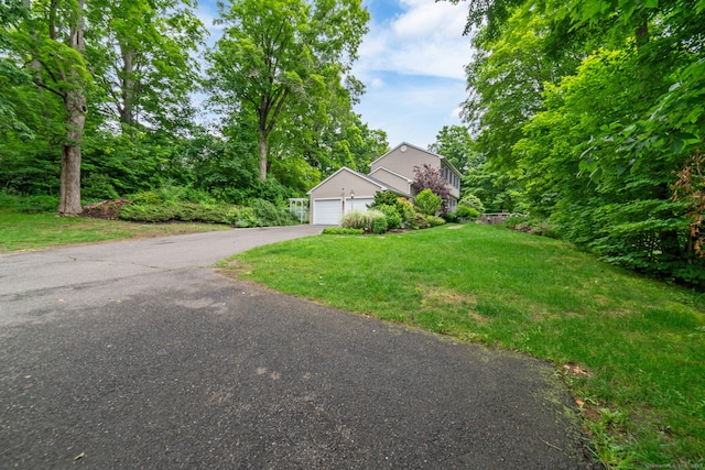 2 Bronson Rd, Prospect, CT 06712 - view of front of home featuring a garage, a front yard, and asphalt driveway
