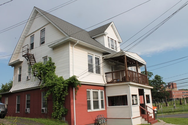120 Linsley Ave, Meriden, CT 06451 - view of front facade with a balcony, entry steps, and roof with shingles