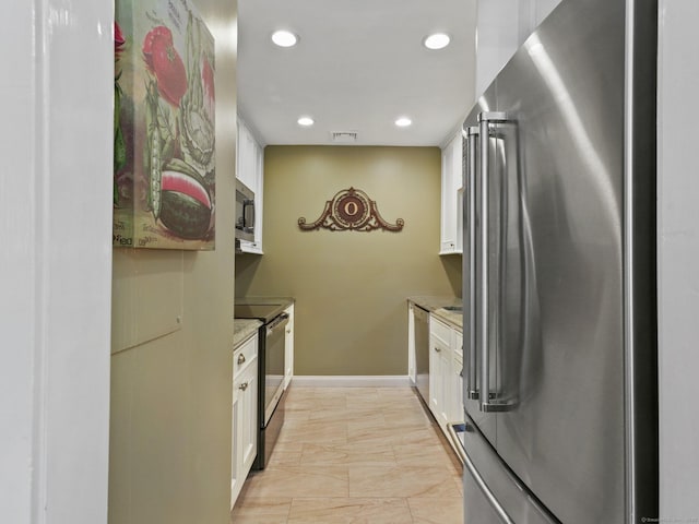 51 Hale Ln Unit 51, Darien, CT 06820 - kitchen featuring stainless steel appliances, white cabinetry, recessed lighting, and light marble finish flooring