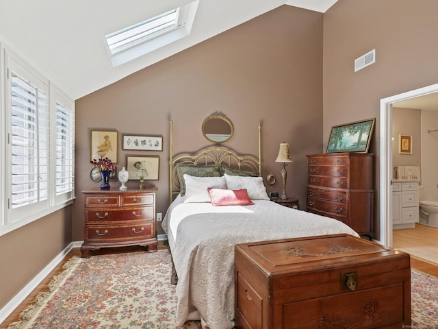 51 Hale Ln Unit 51, Darien, CT 06820 - bedroom with a skylight, wood finished floors, connected bathroom, and high vaulted ceiling