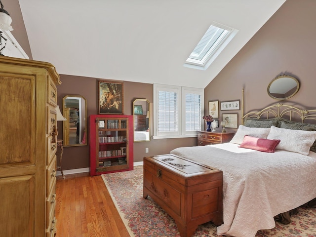 51 Hale Ln Unit 51, Darien, CT 06820 - bedroom with a skylight, light wood-style floors, and vaulted ceiling