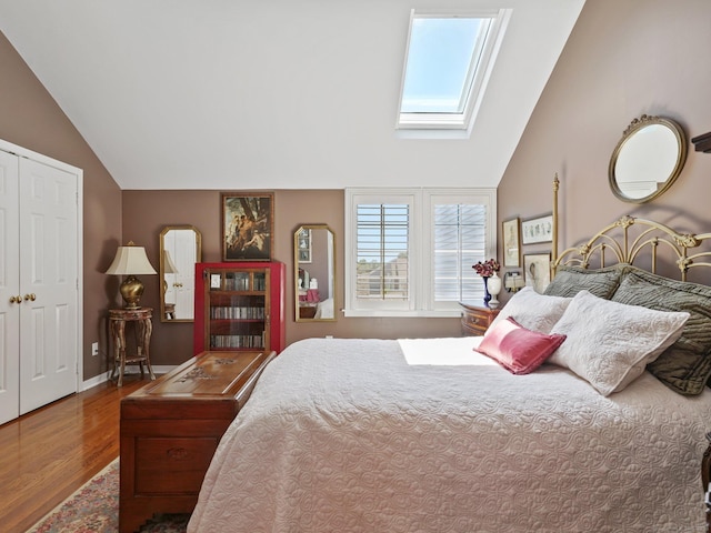 51 Hale Ln Unit 51, Darien, CT 06820 - bedroom featuring a skylight, vaulted ceiling, and wood finished floors