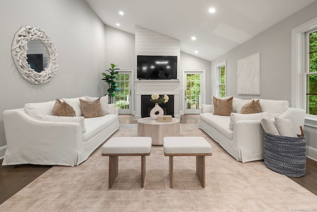 3663 Congress St, Fairfield, CT 06824 - living area with vaulted ceiling, recessed lighting, light wood finished floors, and a large fireplace