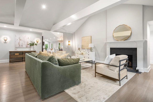 3663 Congress St, Fairfield, CT 06824 - living area featuring recessed lighting, a chandelier, a fireplace, wood finished floors, and high vaulted ceiling