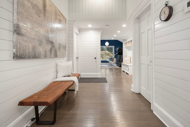 3663 Congress St, Fairfield, CT 06824 - corridor featuring dark wood-style flooring, wood walls, and recessed lighting
