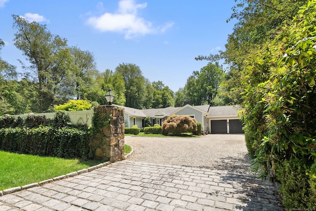 3663 Congress St, Fairfield, CT 06824 - single story home with curved driveway and an attached garage