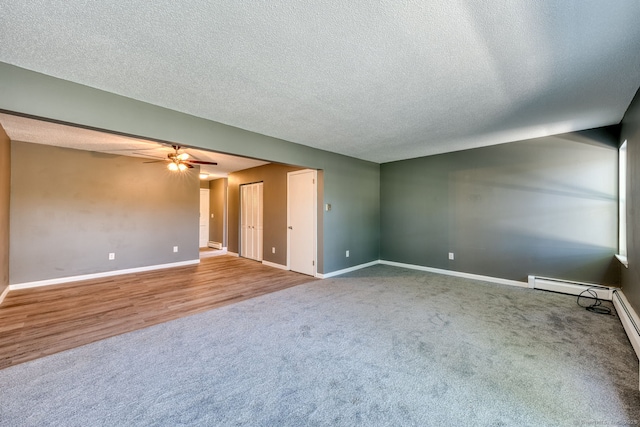 118 Sheraton Ln Unit 118, Norwich, CT 06360 - unfurnished room with carpet floors, a ceiling fan, a textured ceiling, and a baseboard heating unit