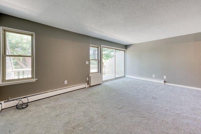 118 Sheraton Ln Unit 118, Norwich, CT 06360 - unfurnished room featuring a baseboard heating unit, a textured ceiling, and carpet floors