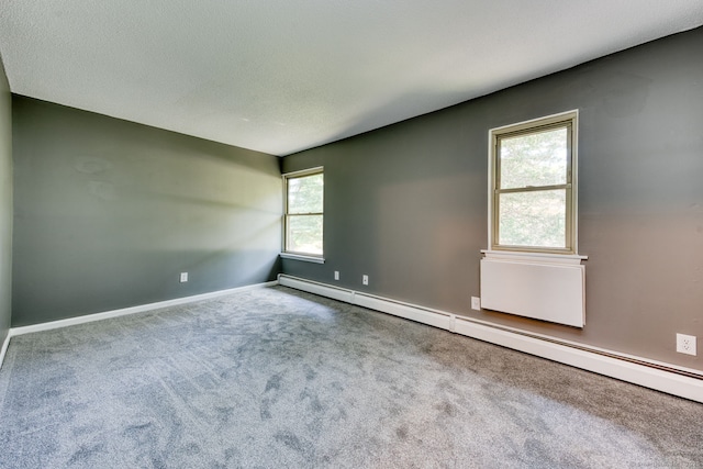 118 Sheraton Ln Unit 118, Norwich, CT 06360 - carpeted spare room featuring baseboard heating and baseboards