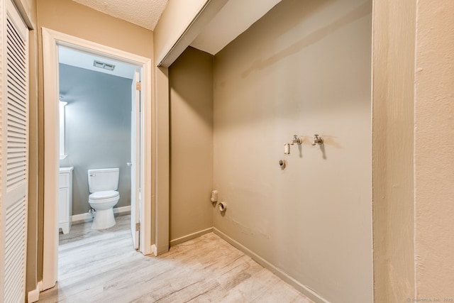 118 Sheraton Ln Unit 118, Norwich, CT 06360 - bathroom featuring toilet and wood finished floors