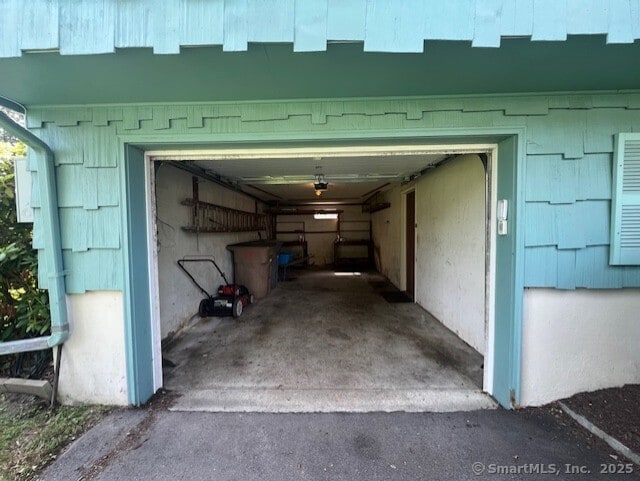 35 Corey Ln, East Lyme, CT 06357 - garage featuring a garage door opener