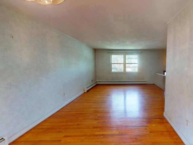 35 Corey Ln, East Lyme, CT 06357 - unfurnished room with wood finished floors, a baseboard radiator, and a baseboard heating unit